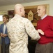 Sgt. Maj. of the Marine Corps Micheal P. Barrett greets a civilian employee