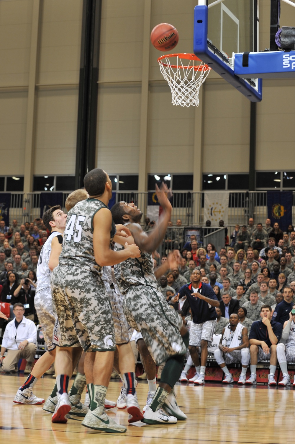 Huskies edge out Spartans 66-62 in Armed Forces Classic