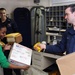 USS Nimitz crew sorts packages