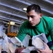 USS Nimitz crew sorts packages