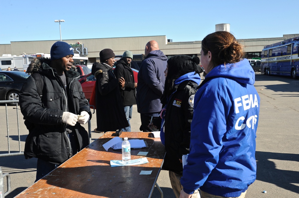 FEMA corps team members aiding survivors