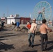 Volunteers lend a broom to Coney Island