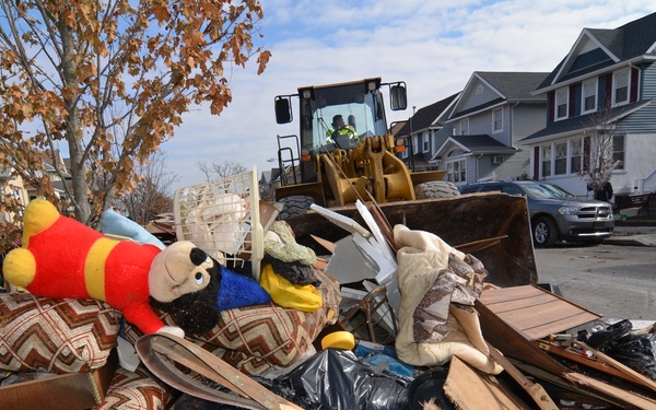 Household items and damages by Superstorm Sandy create piles of trash for homeowners