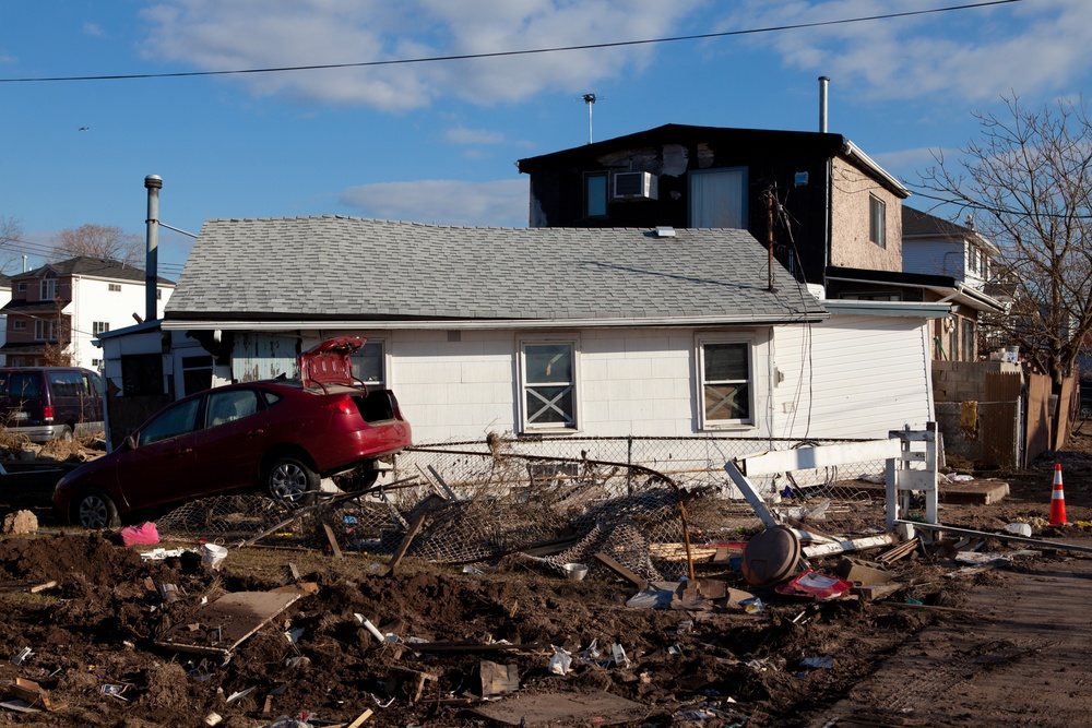 Destroyed cars and homes left in Sandy's wake