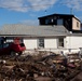 Destroyed cars and homes left in Sandy's wake