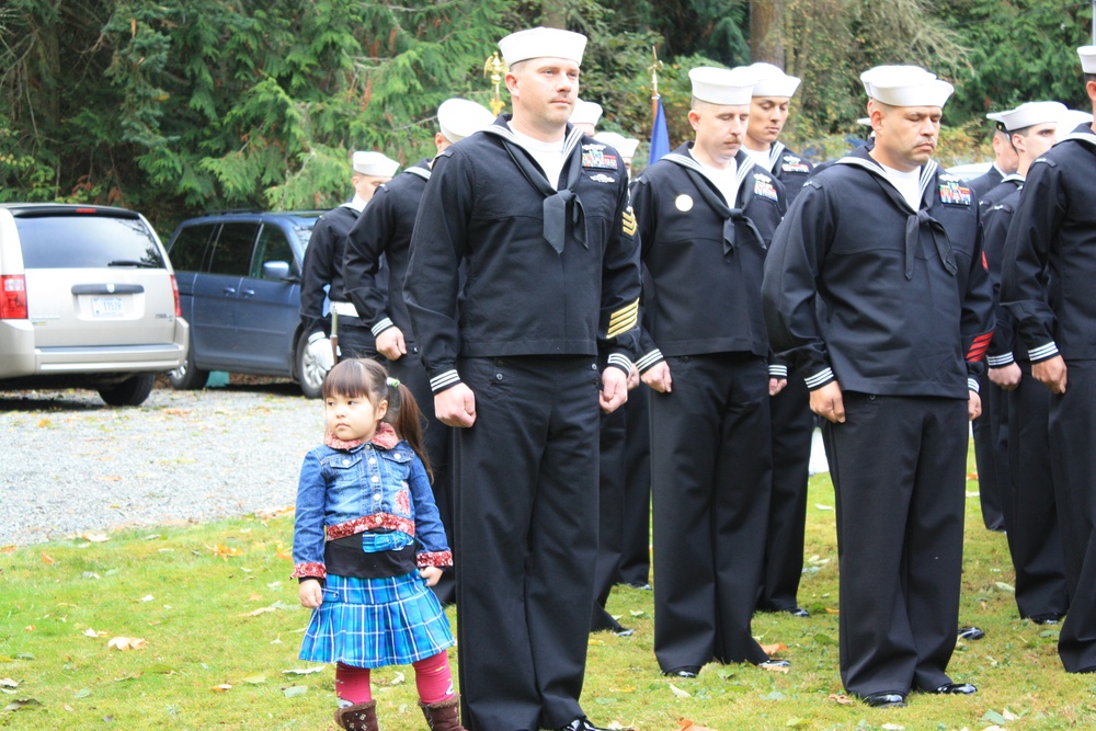Even the youngest members of the Seabee family stand to honor Construction Mechanic Third Class Marvin G. Shields