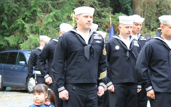 Even the youngest members of the Seabee family stand to honor Construction Mechanic Third Class Marvin G. Shields