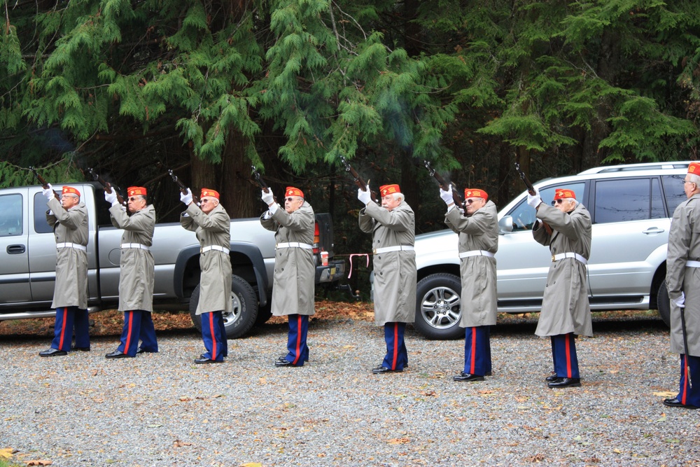 The Honor Guard from Gardiner, Washington fires a 21-gun salute