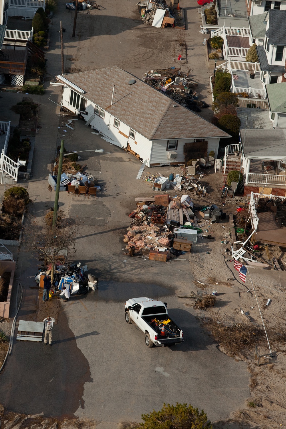 Aerial view of a home washed off of its foundation by Hurricane Sandy in Breezy Point, NY