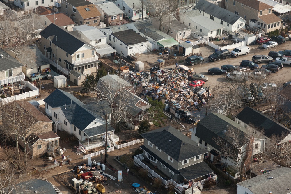 Aerial view of debris piled up outside of homes in Breezy Point, NY