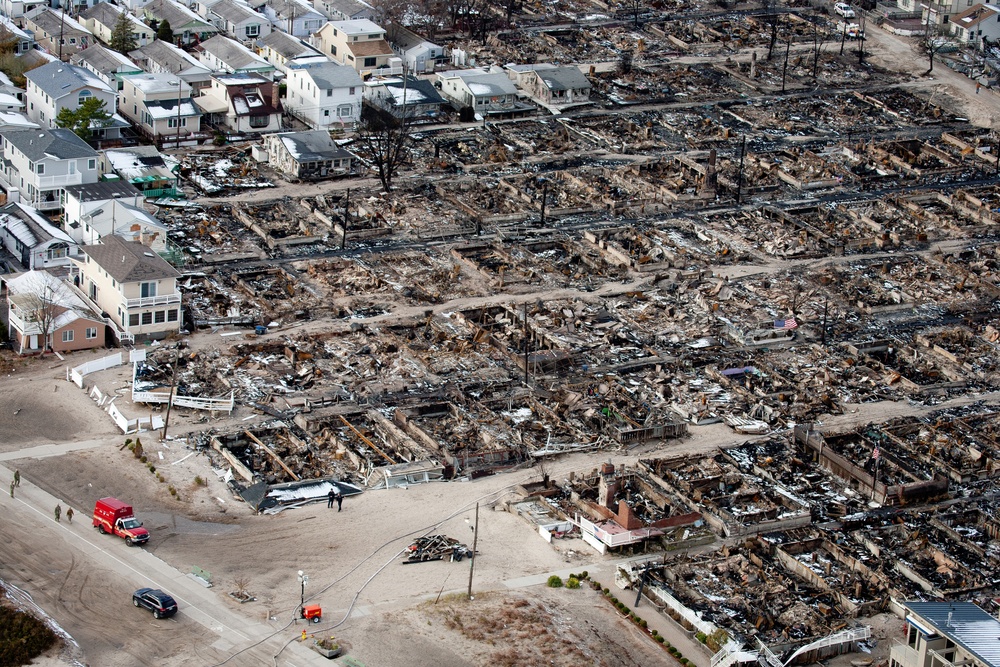 Aerial view of homes that were ravaged by fire in the community of Breezy Point, NY