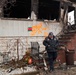 Fire Marshal looks at a home Long Beach that burned down as a result of Hurricane Sandy