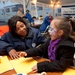 FEMA Community Relations worker listens to young hurricane survivor in a Disaster Recovery Center