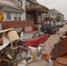 Debris piled up outside of homes in Long Beach, NY