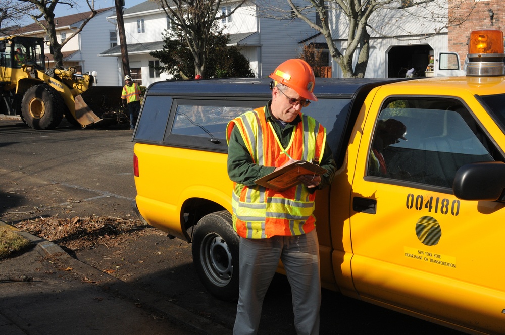 DOT inspector monitors debris removal