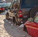 Cars stuck in sand in front of homes in Long Beach, New York