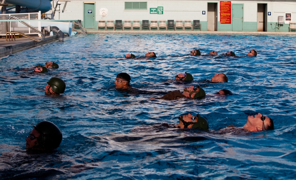 Marines tread through water instructor survival course