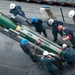 USS Frank Cable crew conducts maintenance