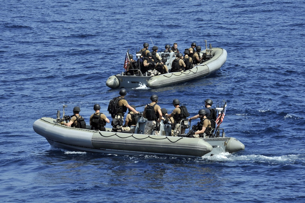 USS Jason Dunham sailors approach fishing vessel