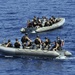 USS Jason Dunham sailors approach fishing vessel