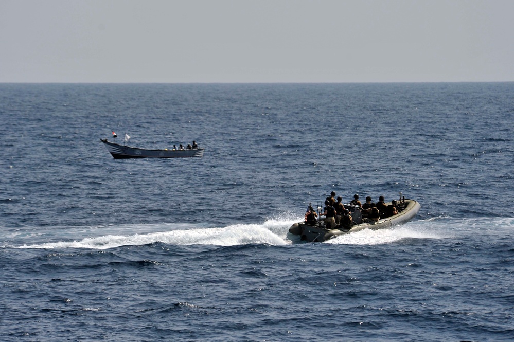 USS Jason Dunham sailors approach fishing vessel