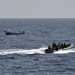 USS Jason Dunham sailors approach fishing vessel