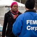 FEMA Corps listens to disaster survivor at the FEMA Disaster Recovery Center in Far Rockaway, New York.