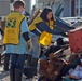 Mormon Helping Hands volunteers assist hurricane survivors by cleaning out their flood damaged homes.