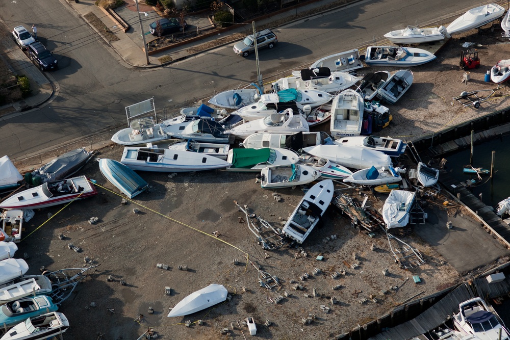 Aerial view of boats tossed ashore near Nautical Mile, New York.