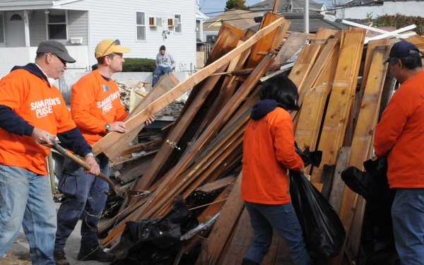 Volunteers help Hurricane Sandy survivors