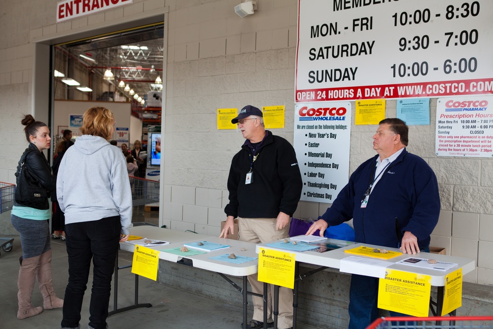 FEMA Community Relations Specialists talk to survivors at a local Costco