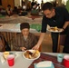 Residents, nursing home staff feast with service members