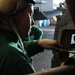 USS Nimitz sailors perform helicopter maintenance