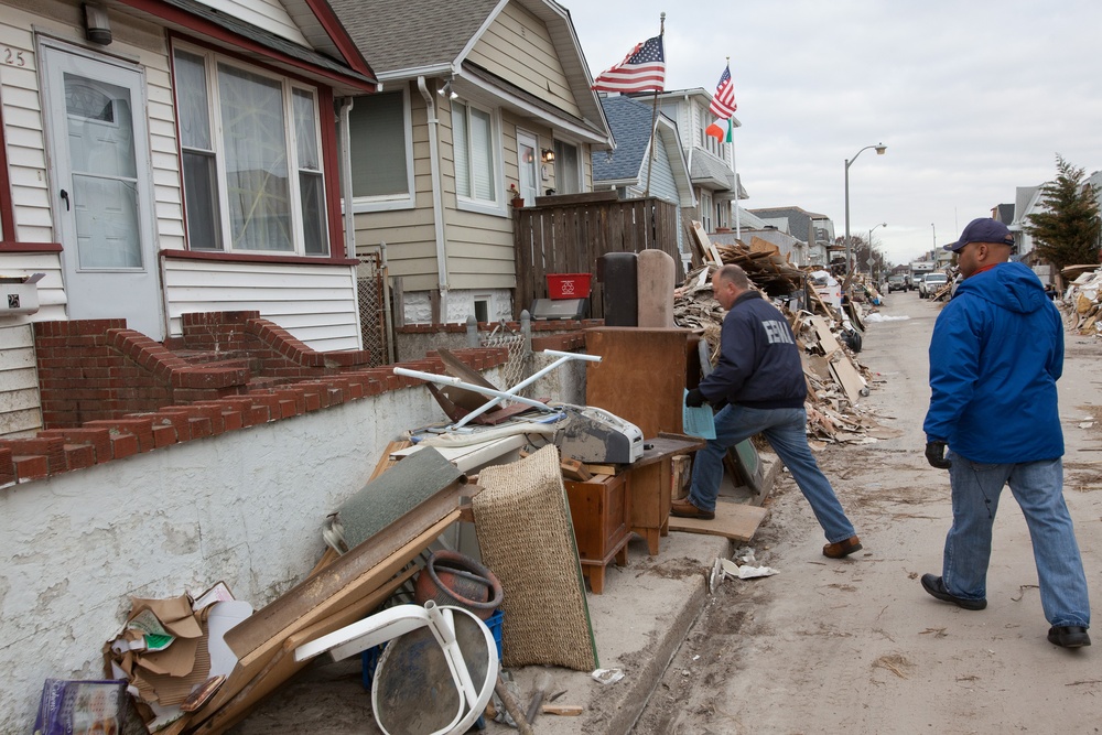 Community Relations workers canvas neighborhood in Long Beach, New York.