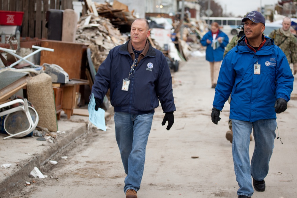 Community Relations workers canvas neighborhood in Long Beach, New York.