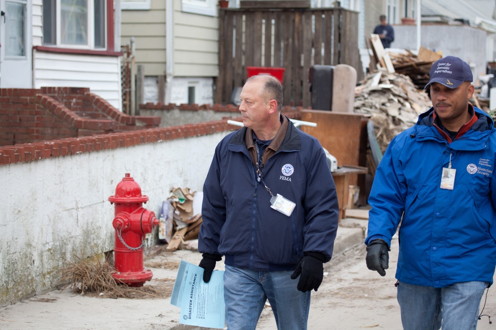 Community Relations workers canvas neighborhood in Long Beach, New York.