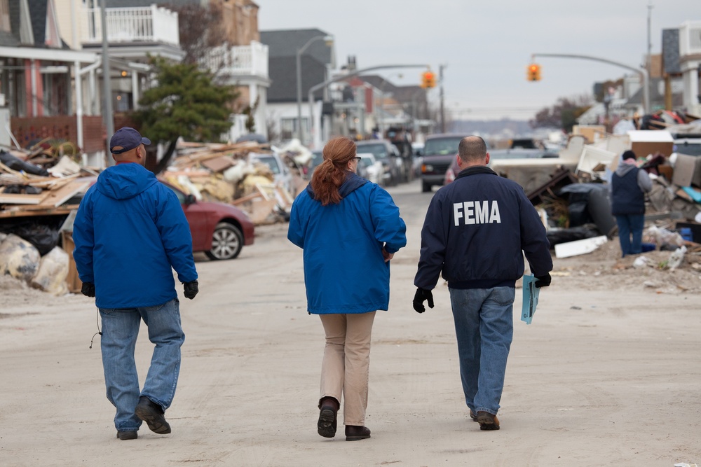 Community Relations workers canvas neighborhood in Long Beach, New York.