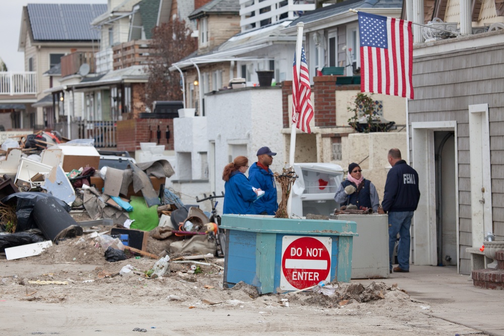 Community Relations workers canvas neighborhood in Long Beach, New York.