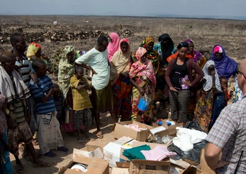 US service members deliver supplies to Bi’idley storm victims