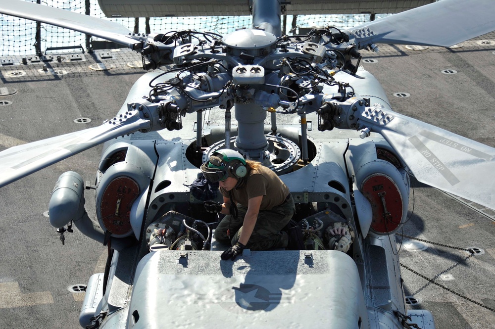 Checking an SH-60B Sea Hawk helicopter