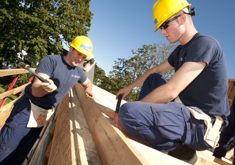 US Coast Guard Academy cadets work on a Habitat for Humanity house in New London, Conn.