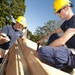US Coast Guard Academy cadets work on a Habitat for Humanity house in New London, Conn.