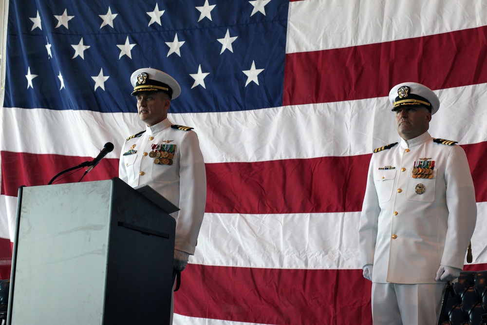 Cmdr. Brad L. Arthur relieves Cmdr. Brian K. Pummill as commanding officer of Helicopter Sea Combat Squadron 9 at change of command ceremony