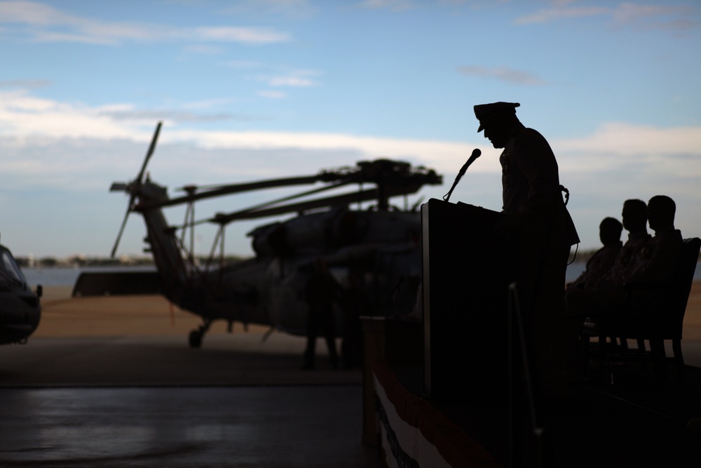 Cmdr. Brad L. Arthur relieves Cmdr. Brian K. Pummill as commanding officer of Helicopter Sea Combat Squadron 9 at change of command ceremony