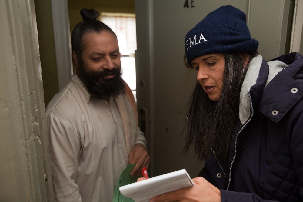 FEMA Community Relations specialist assists hurricane survivor in Coney Island, NY