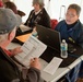 FEMA Disaster Recovery specialist assists Hurricane Sandy survivor at a FEMA/State Disaster Recovery Center