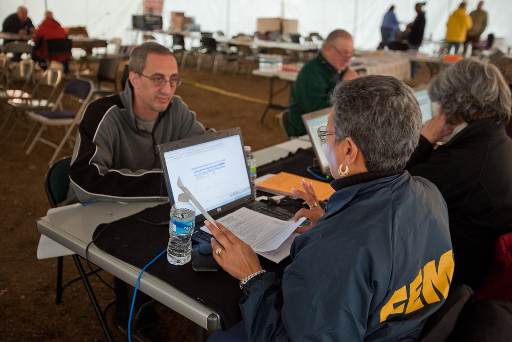 FEMA Disaster Recovery specialist assists Hurricane Sandy survivor with FEMA registration