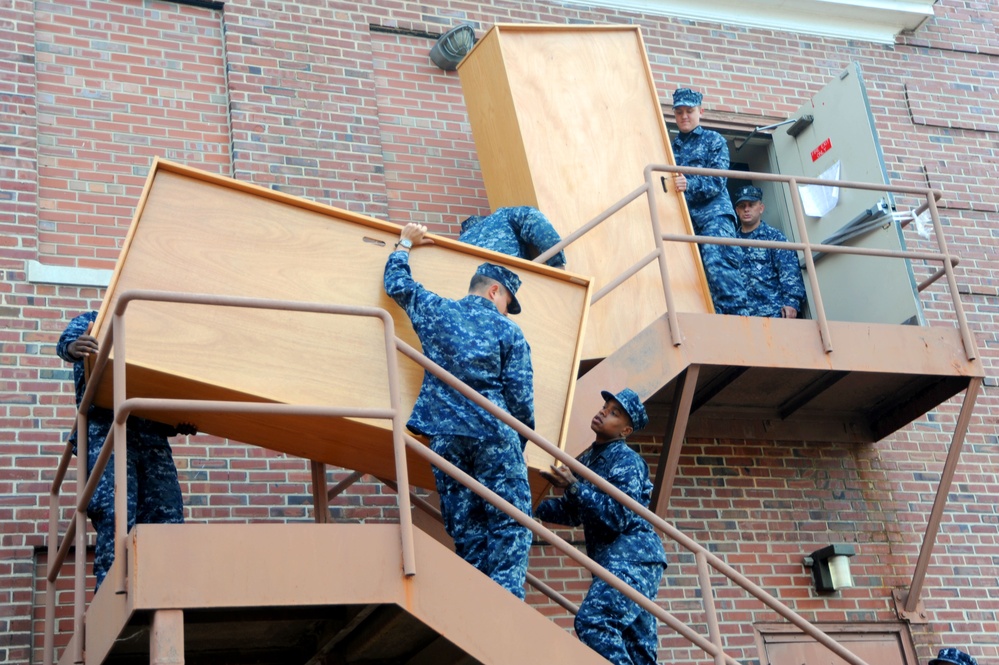 Sailors move furniture