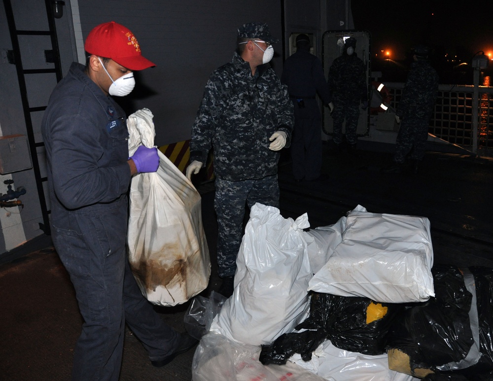 USS Carr crew offloads seized drugs