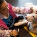 Comfort Dog provides support to a disaster survivor at a FEMA Recovery Center in Long Beach, NY